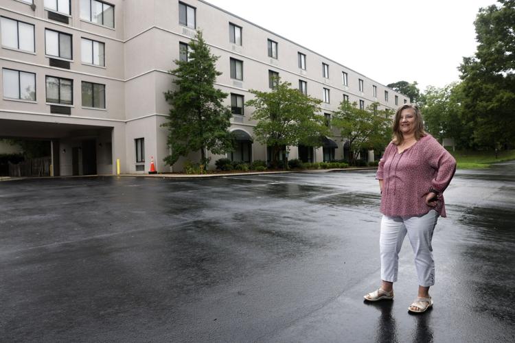 Shanna Reece, Executive Director of the Servant Center, stands at the organization’s newly acquired facility on Boulevard Street, formerly known as Holden Heights assisted-living. Spanning four stories and 37,000 square feet, the center will feature 21 single-occupancy rooms designed for veterans transitioning out of homelessness, along with 22 specialized beds for individuals requiring respite care during recovery from illness or injury.