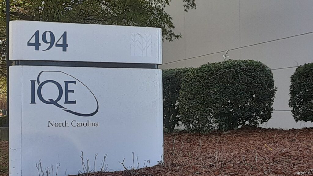 IQE's manufacturing facility in Greensboro, North Carolina, a key site for the company’s $305 million expansion. The facility, located on Gallimore Dairy Road, features a modern industrial design, equipped with cutting-edge technology for semiconductor material production.