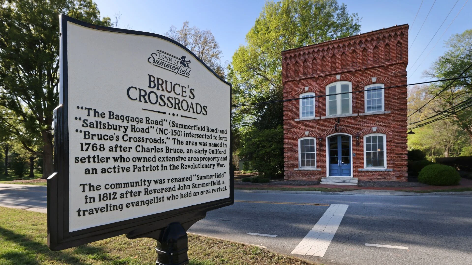 A historical marker and the Summerfield Town Hall, the historic Brittain Store, at the main intersection of Oak Ridge and Summerfield roads.
