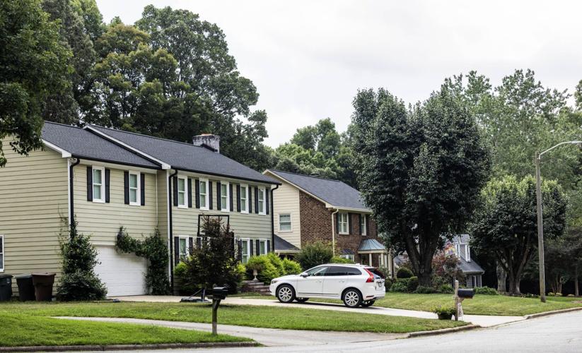 Fourteen residents of New Irving Park are suing the City of Greensboro over a rezoning that would allow a developer to build townhomes in the neighborhood, which is now mostly single-family homes.